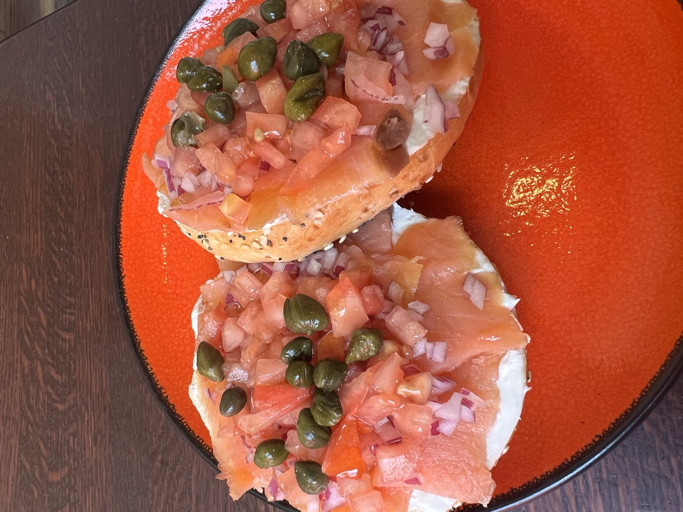 Bagel with lox, cream cheese, capers, tomato and red onion at Tino's Tazza